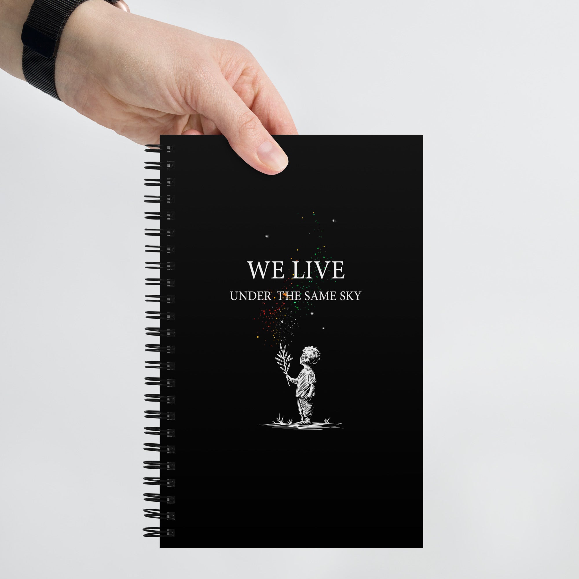 Spiral notebook: We Live Under The Same Sky